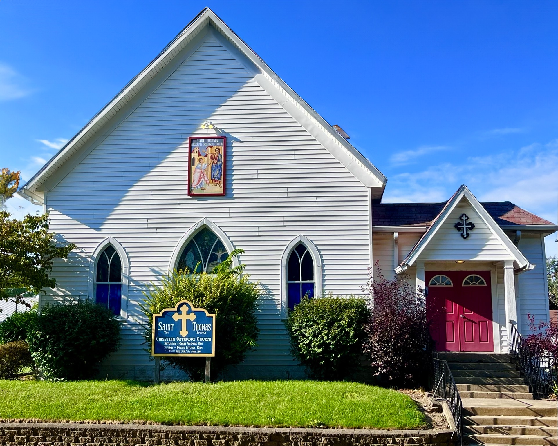 St. Thomas the Apostle Orthodox Church, white clapboard exterior with red door