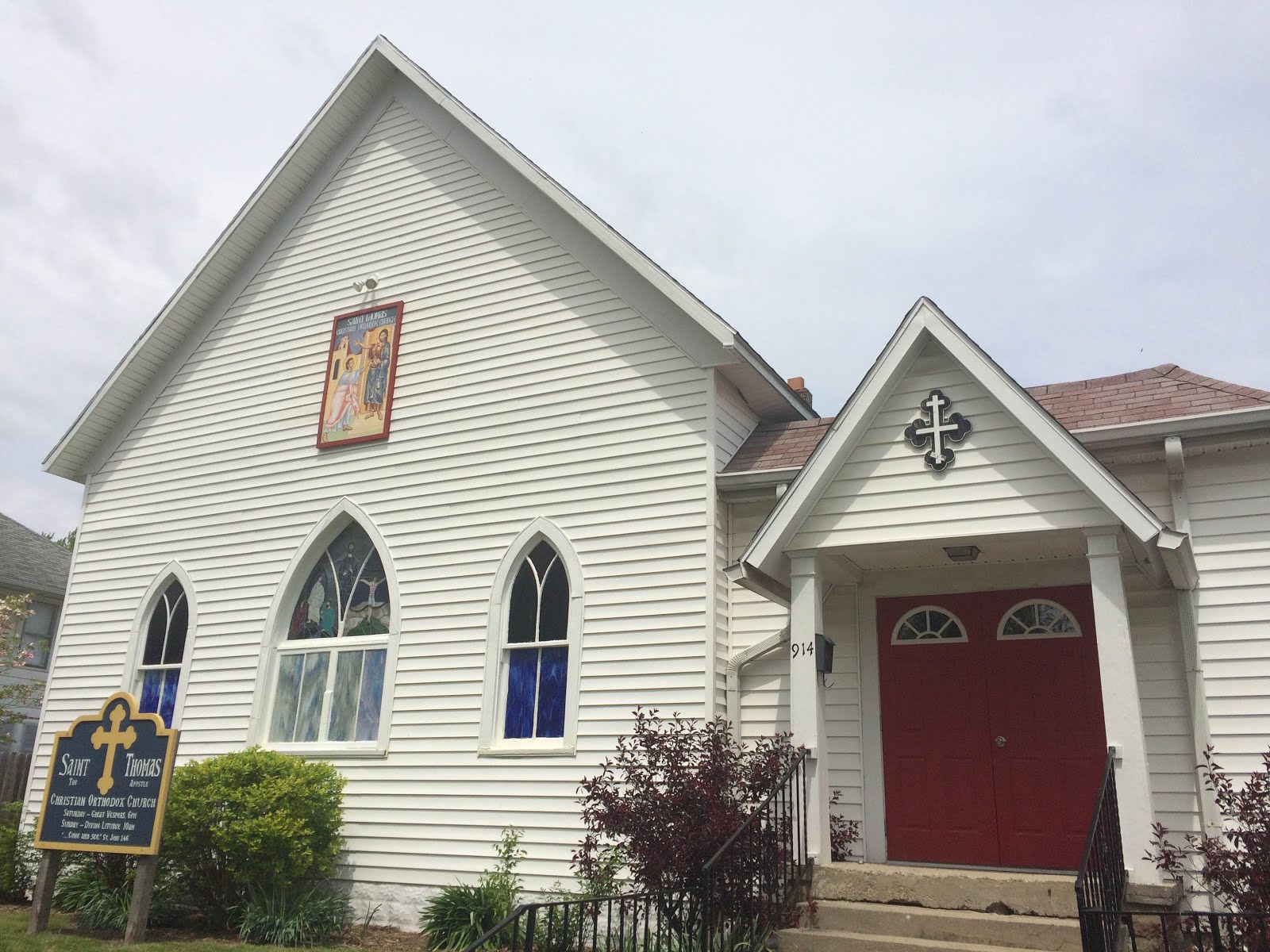Wider view of the white church exterior